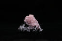 Pink rose calcite with clear quartz on black tourmaline, featured in VDE’s natural mineral specimen guide
