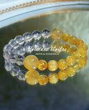 VDE crystal bracelets with translucent and golden beads arranged on a dish